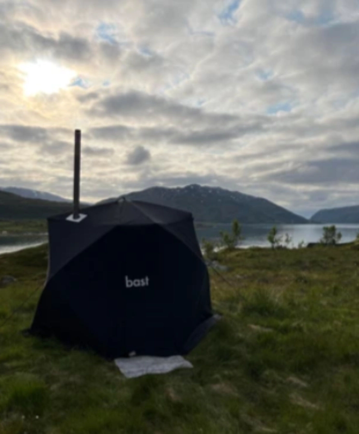 Bast portable sauna tent in a Nordic mountain landscape