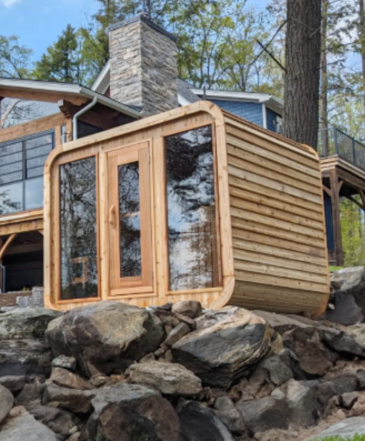 LeisureCraft Luna Sauna installed beside a lakeside home