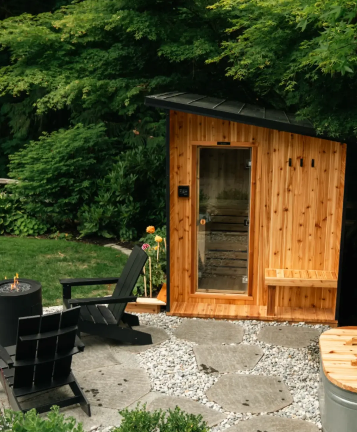 Nootka Cube Sauna in an outdoor garden setting