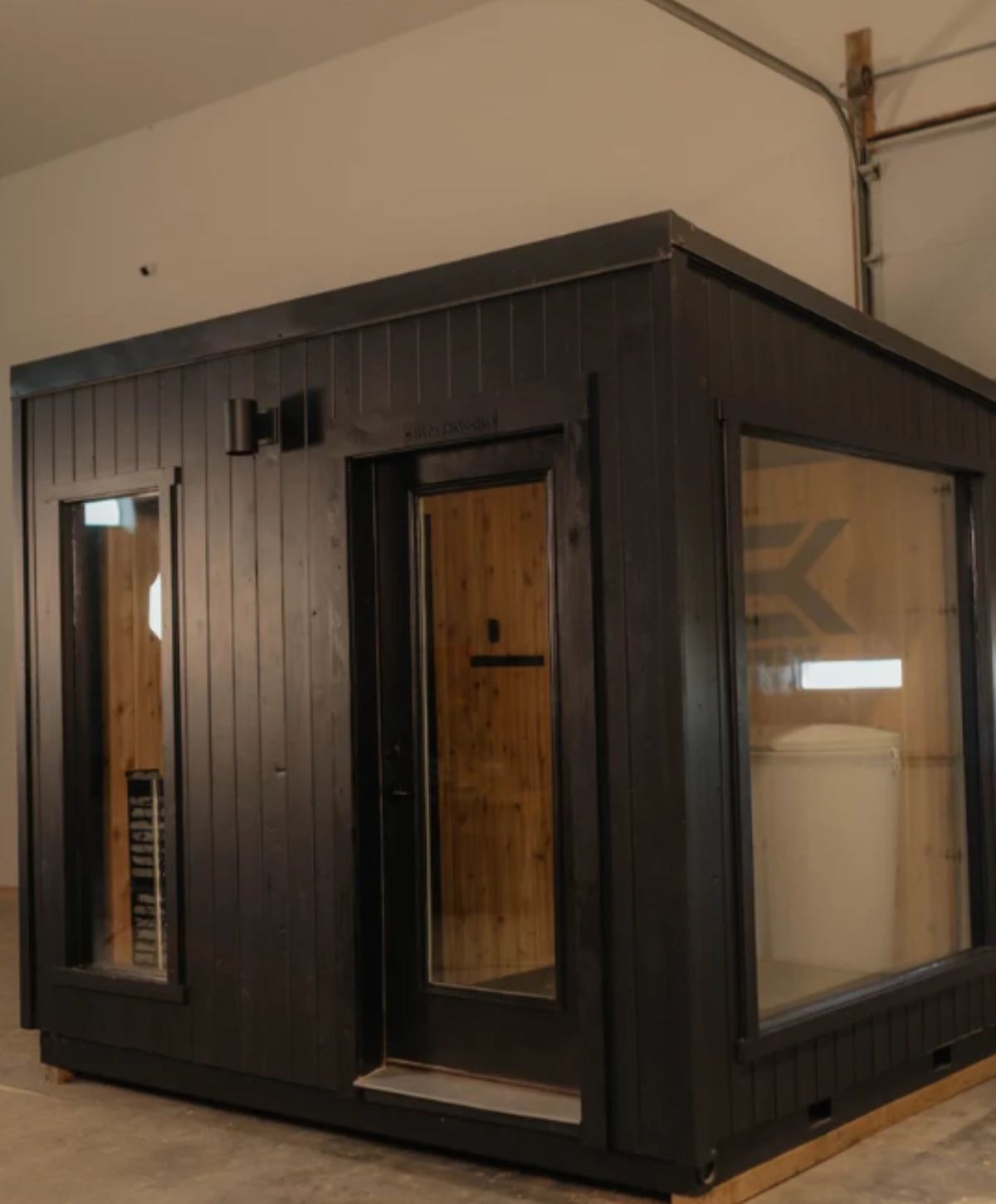 Sweat Kingdom SK Contrast sauna with black exterior and cedar interior