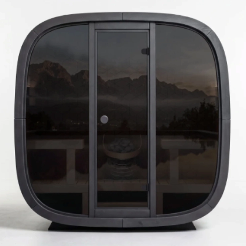 Leil Black Cube Premium outdoor sauna kit with curved dark exterior and glass front